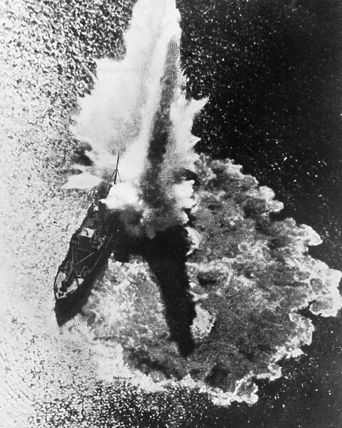 A German bomb explodes on a British ship of the R royal Navy during an engagement in