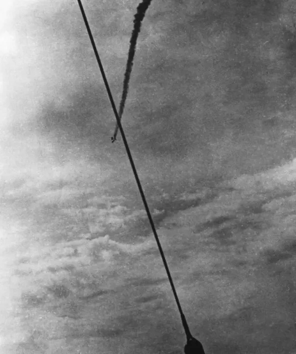 Framed Print : A German bomber shot down by a RAF fighter, caught in a barrage balloon seen here