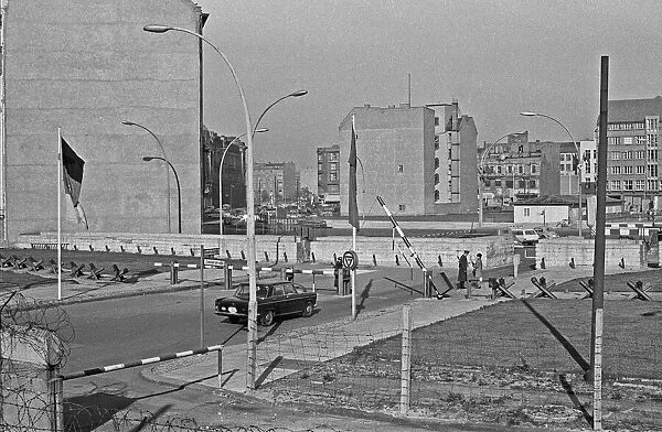 A German diplomatic car crossing the Berlin Wall at Checkpoint Charlie