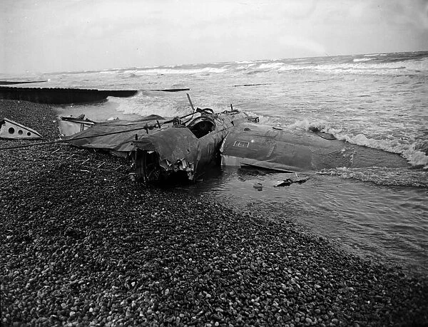 A German Luftwaffe fighter plane downed by the RAF and resting on the beach at Norfolk