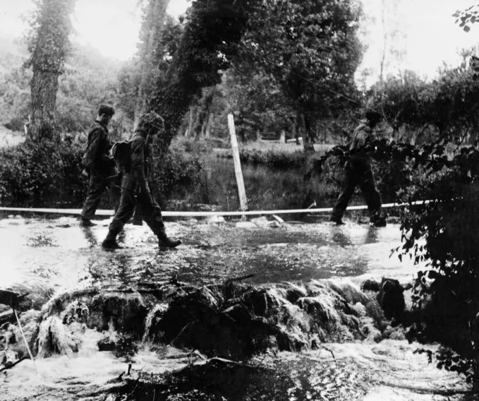 Framed Print : German snipers being escorted across the Odon river after capture in the Odon valley