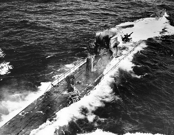A German submarine sinking after being attacked with depth charges