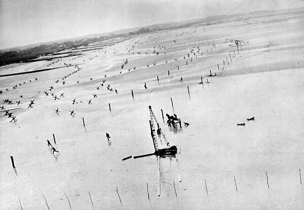 GERMAN TROOPS RUN FOR COVER AS ALLIED PLANE MAKES ATTACK ON BEACH OBSTACLES DURING D-DAY