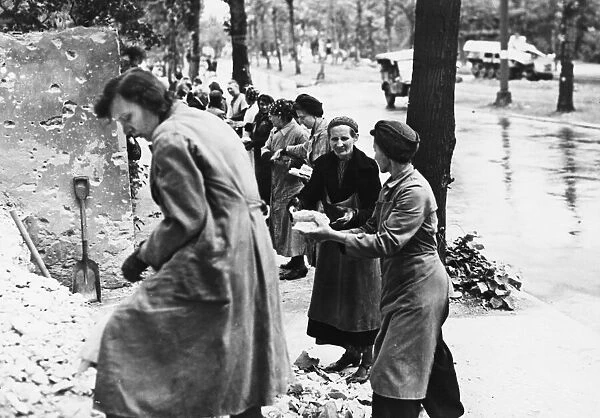 German women in Charlottenburg clearing rubble of bomb-out structures during the Second