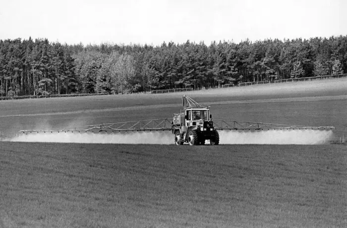 Framed Print : The giant 80 ft. booms of this MB-Trac-mounted sparyer allows the farmer to spray huge Framed Print : The giant 80 ft. booms of this MB-Trac-mounted sparyer allows the farmer to spray huge
