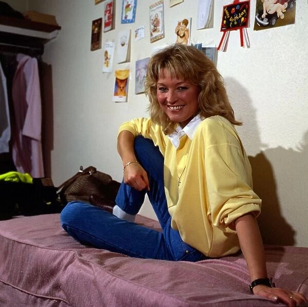 Gillian Taylforth sitting on bed November 1987
