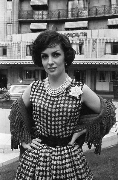 Gina Lollobrigida, Italian actress, poses for pictures outside the Dorchester Hotel
