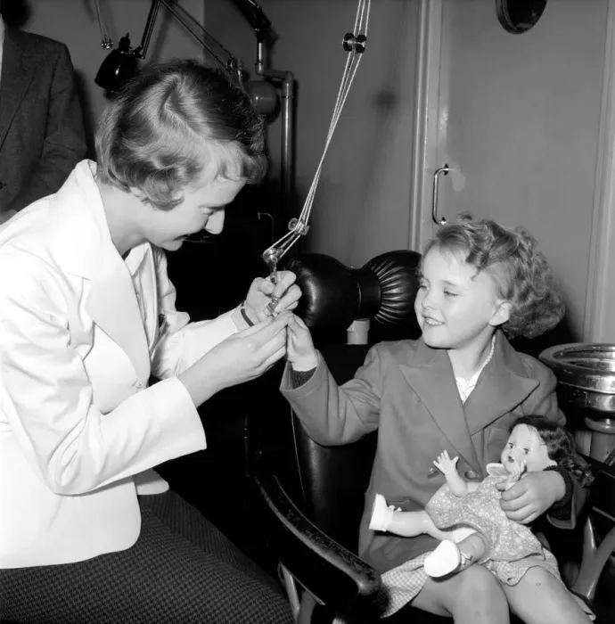 Framed Print : Girl in the Dentists Chair at a Dental Clinic for children. 1954
