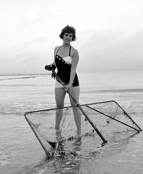 Girl with fishing net at Margate 17th July 1960