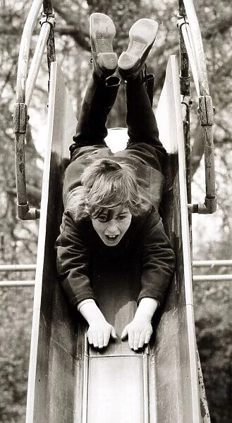 Girl on a slide, circa 1980