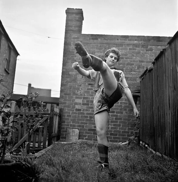 Girl soccer player Margaret Parkes. 1956 A509-004
