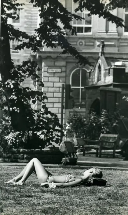 Framed Print : A girl sunbathes in St. Johns churchyard in Newcastle during the long hot summer in Framed Print : A girl sunbathes in St. Johns churchyard in Newcastle during the long hot summer in