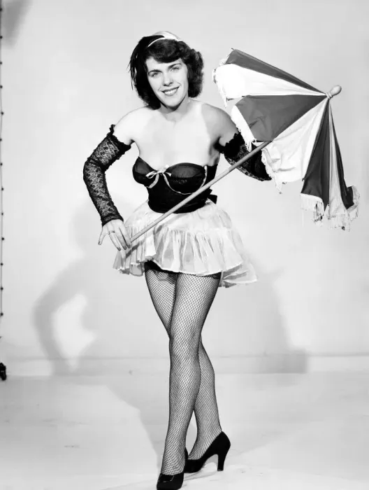 Framed Print : Show girl with umbrella. circa 1957 Framed Print : Show girl with umbrella. circa 1957