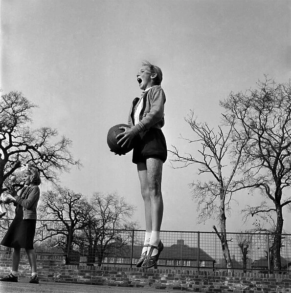 Girlks playing netball at Bessemer Primary School, Dulwich. November 1952 C5556