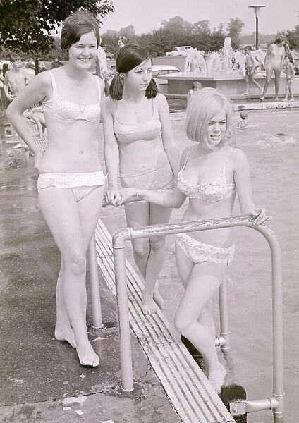 Girls in bikinis enjoying the hot summer at Ryton open-air swimming pool, Coventry