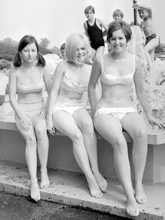Framed Print : Girls in bikinis enjoying the hot summer at Ryton open-air swimming pool, Coventry Framed Print : Girls in bikinis enjoying the hot summer at Ryton open-air swimming pool, Coventry