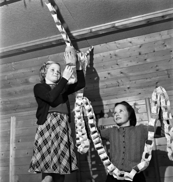 Framed Print : Girls hanging up Christmas decorations in their cabin. Pestalozzi Children Framed Print : Girls hanging up Christmas decorations in their cabin. Pestalozzi Children