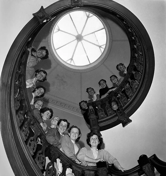 Girls at Kilroy castle line up on the spiral staircase. June 1952 C3148