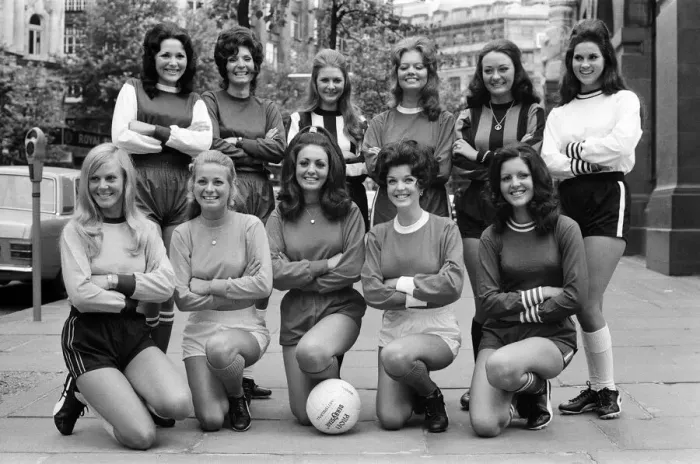 Framed Print : Eleven girls this morning lined-up dressed in the colours of their favourite football
