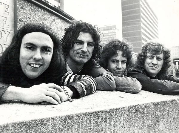 Glam rock group Slade posing for pictures in Birmingham City Centre