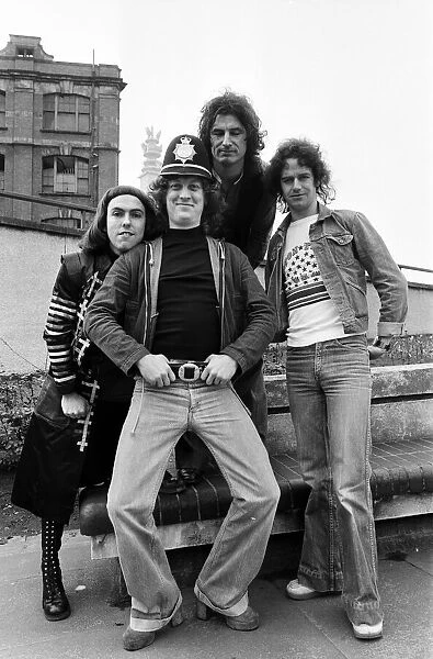 Glam rock group Slade posing for pictures in Birmingham City Centre. 25th March 1977