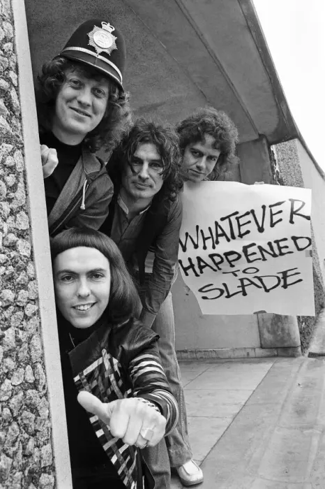Framed Print : Glam rock group Slade posing for pictures in Birmingham City Centre. 25th March 1977 Framed Print : Glam rock group Slade posing for pictures in Birmingham City Centre. 25th March 1977