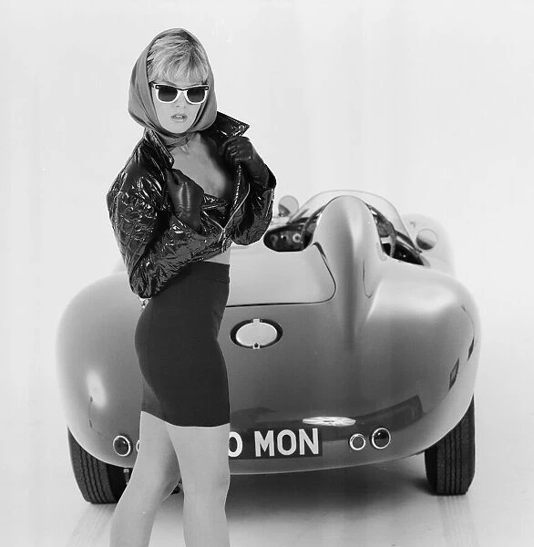 Glamour model Caroline Delahunty poses next to a Ferrari. 19th April 1988