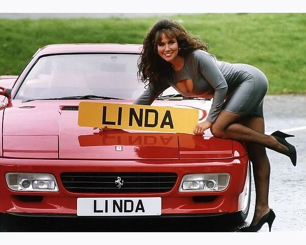 Glamour Model Linda Lusardi leans on a 512 TR Ferrari worth £