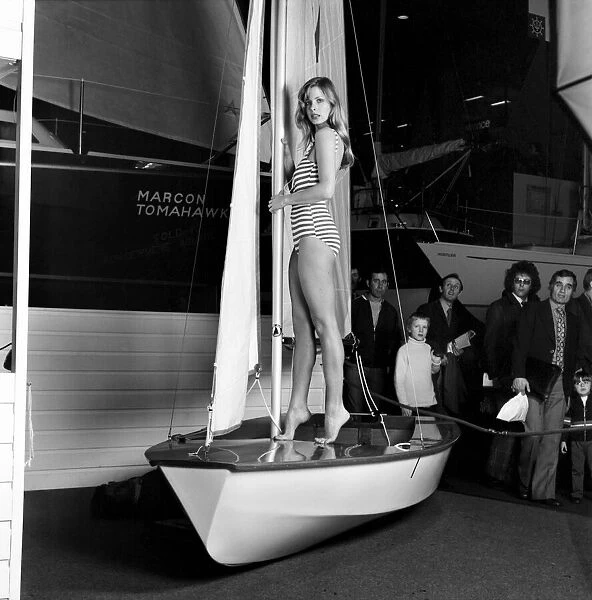 Top glamour model Stephanie McLean posing on a sailboat January 1975