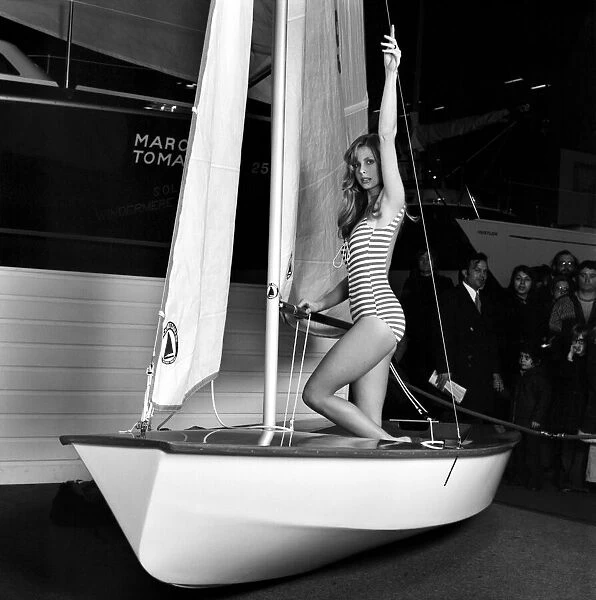 Top glamour model Stephanie McLean posing in a sailboat January 1975