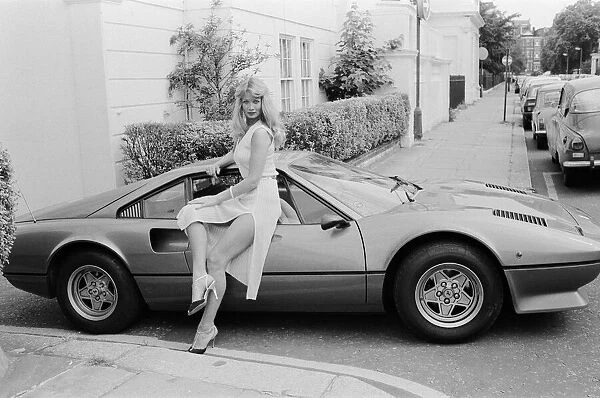 Glamour model Tina poses next to a Ferrari 308 GTB. 11th July 1979