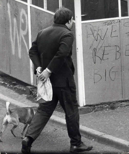 Glasgow Gangs July 1968 marching to the arms dump a youth carring a brown paper bag