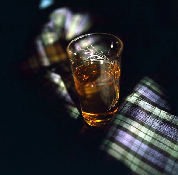 A glass of single malt whisky Tartan Scotland Circa 1970