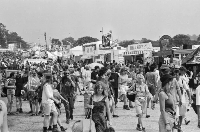 Framed Print : Glastonbury Festival 1994. General scenes. Festival goers walk besides Framed Print : Glastonbury Festival 1994. General scenes. Festival goers walk besides
