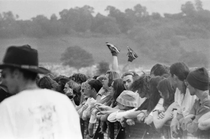 Framed Print : Glastonbury Festival 1994. General scenes of the crowd with a pair of legs Framed Print : Glastonbury Festival 1994. General scenes of the crowd with a pair of legs