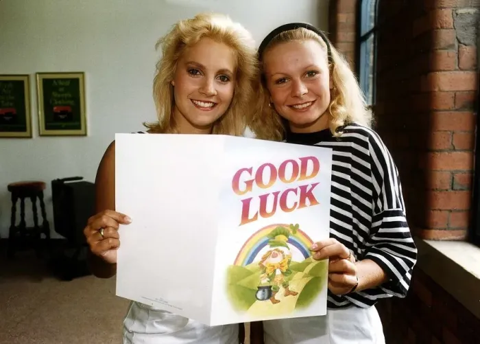 Framed Print : Glenda McKay with Actress Mellnida Burrows holding up good luck card Framed Print : Glenda McKay with Actress Mellnida Burrows holding up good luck card