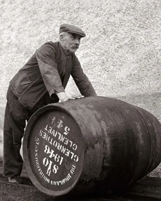 Framed Print : A Glenlivet Distillery worker in Scotland rolls a barrel of their finest single malt Framed Print : A Glenlivet Distillery worker in Scotland rolls a barrel of their finest single malt