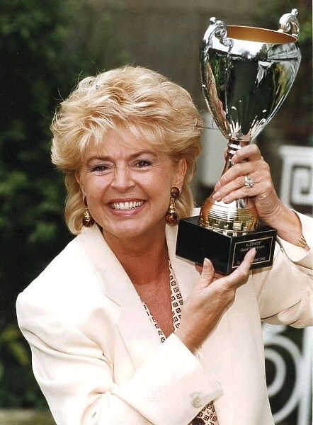 Gloria Hunniford with Good Neighbours award trophy - February 1994 16  /  02  /  1994