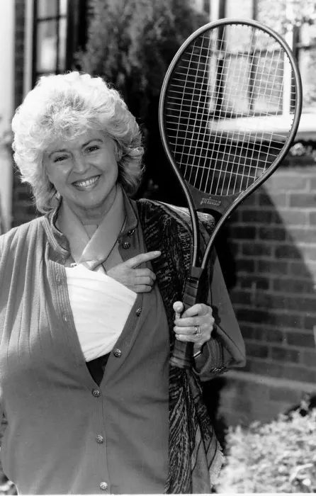 Framed Print : Gloria Hunniford TV Presenter holding the tennis racket she was useing when she broke her Framed Print : Gloria Hunniford TV Presenter holding the tennis racket she was useing when she broke her