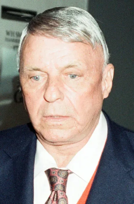 Framed Print : A glum looking Frank Sinatra seen here arriving at Heathrow Airport at the start of his