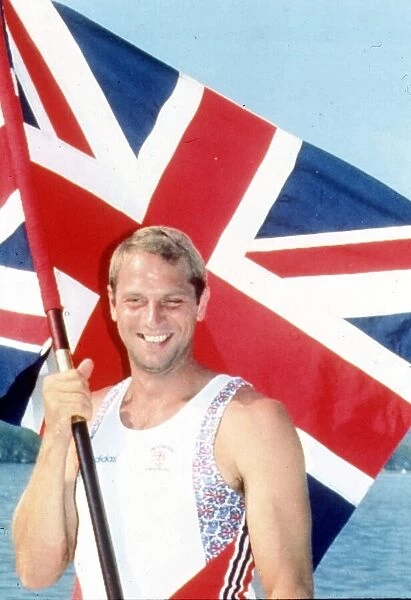 Gold Medalist Oarsman Steve Redgrave with Union Jack flag after winning the coxless pairs