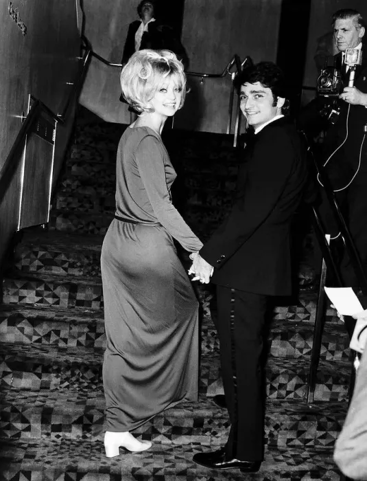 Framed Print : Goldie Hawn Actress holding hands with her husband Gus Trikonis at a film premiere in Framed Print : Goldie Hawn Actress holding hands with her husband Gus Trikonis at a film premiere in