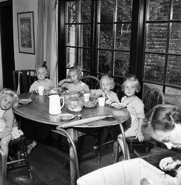 Good Quads enjoying a meal at Guiders Camp, Foxlease, Hants. July 1952 C3575