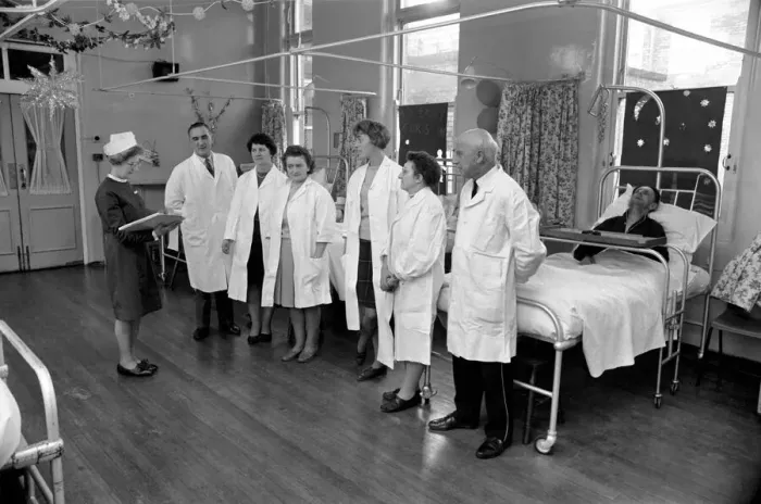 Framed Print : The Good Samaritans stand on parade in a hospital ward. They are some of the volunteers