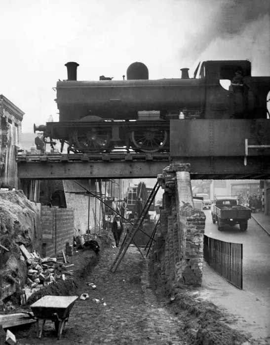 Framed Print : A goods train makes its way across the tow bridge in the centre of Stourbridge as it is Framed Print : A goods train makes its way across the tow bridge in the centre of Stourbridge as it is
