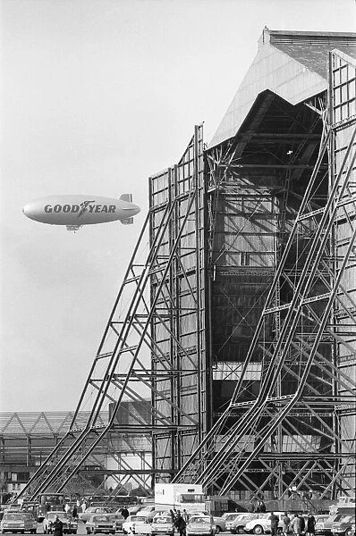 The Goodyear airship Europa seen here flying past the giant R101 sheds at Cardington