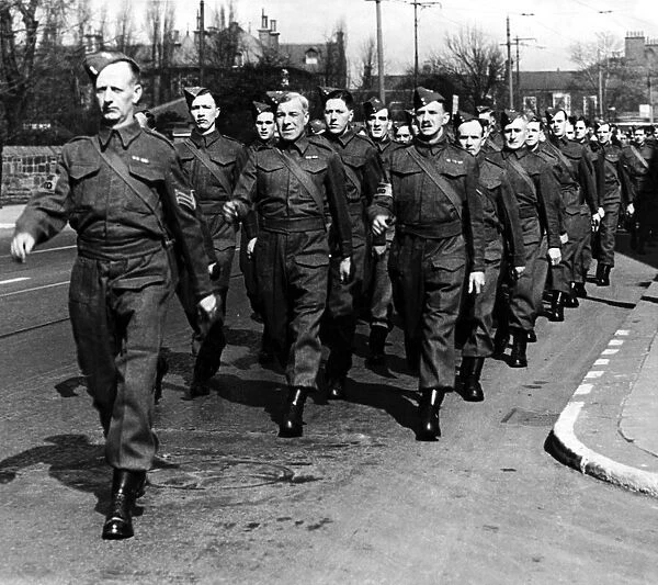 Gosforth Home Guard members marching to the Royalty Cinema to see a special film show