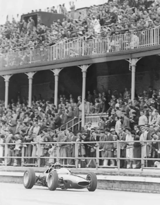 Framed Print : Graham Hill Grand Prix Motor Racing Driver April 1963 driving his car past the main Framed Print : Graham Hill Grand Prix Motor Racing Driver April 1963 driving his car past the main