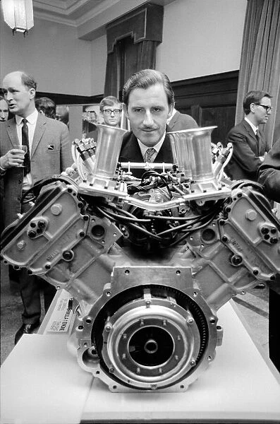 Graham Hill looks at the first ever Ford Formula 1 engine in Ford Regent Street
