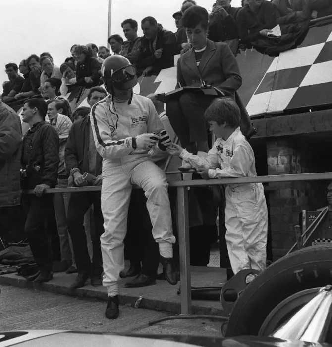 Framed Print : Graham Hill motor racing driver with son Damon Hill at Silverstone 1967 Framed Print : Graham Hill motor racing driver with son Damon Hill at Silverstone 1967